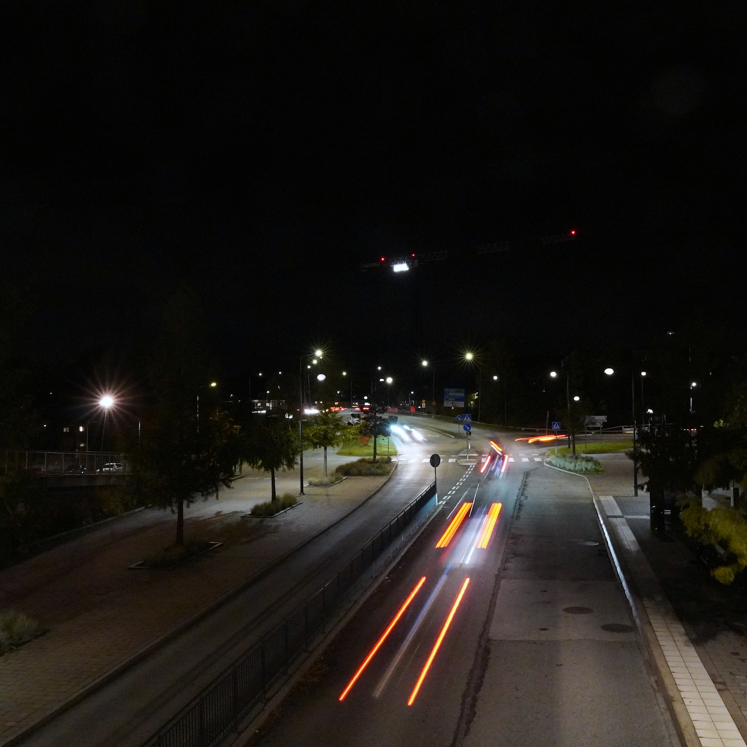 Cars shot with long exposure in the dark making their lights appear as stripes.
