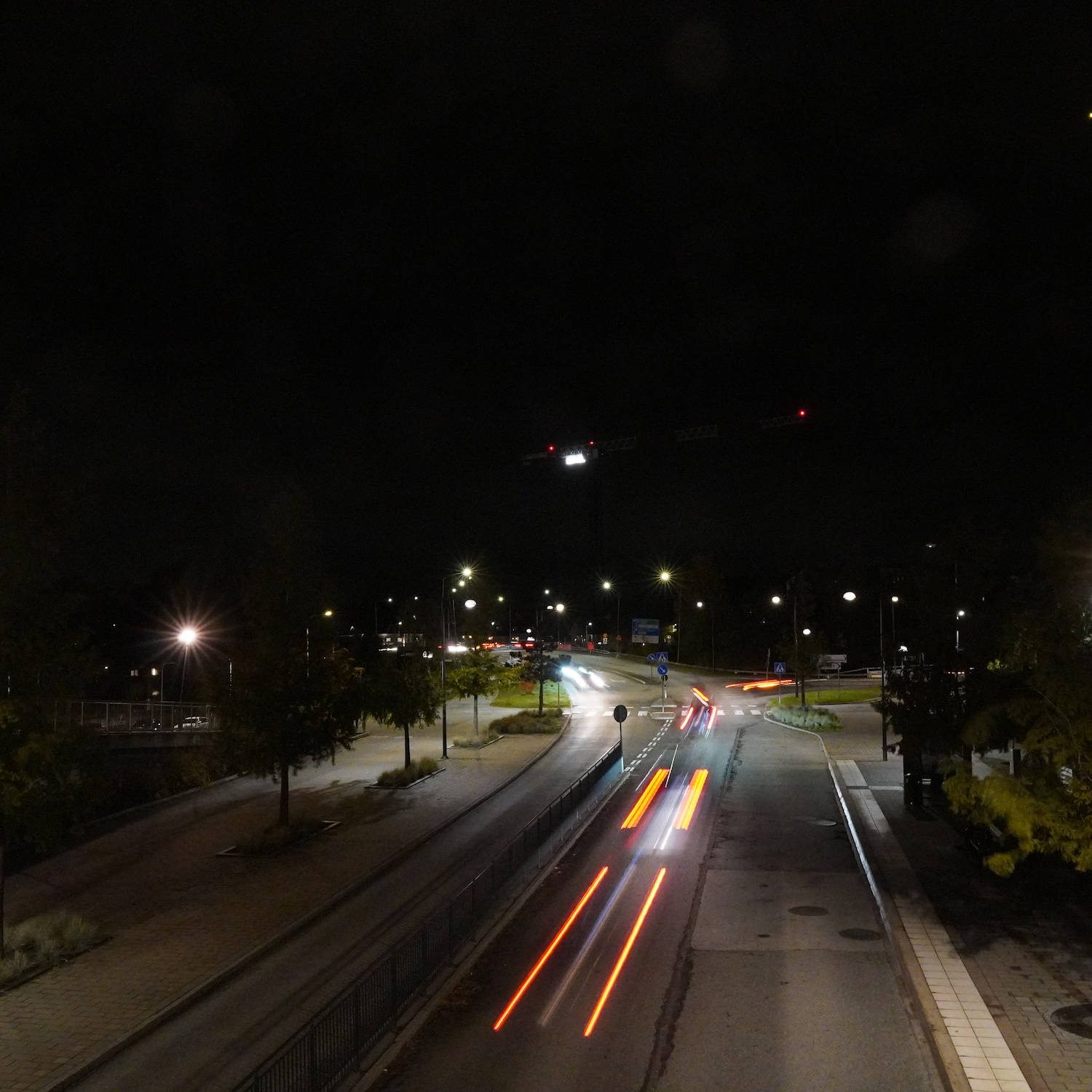 Cars shot with long exposure in the dark making their lights appear as stripes.